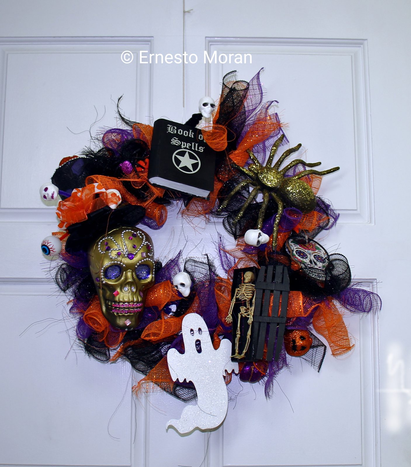 Halloween wreath with gold skull and Book of Spells